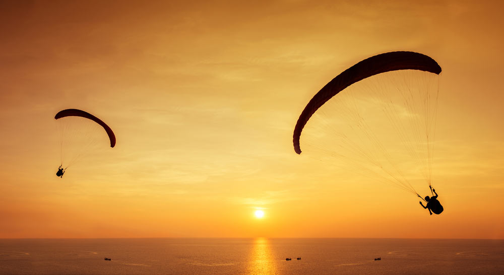 Paragliders at Sunset